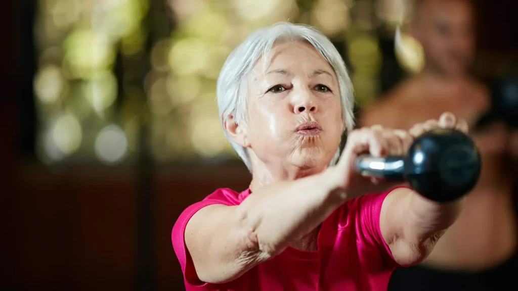 Toning Bingo Wings: Effective Exercises and Tips for Achieving Sleeker Arms 2 Person performing arm exercises with dumbbells Dover