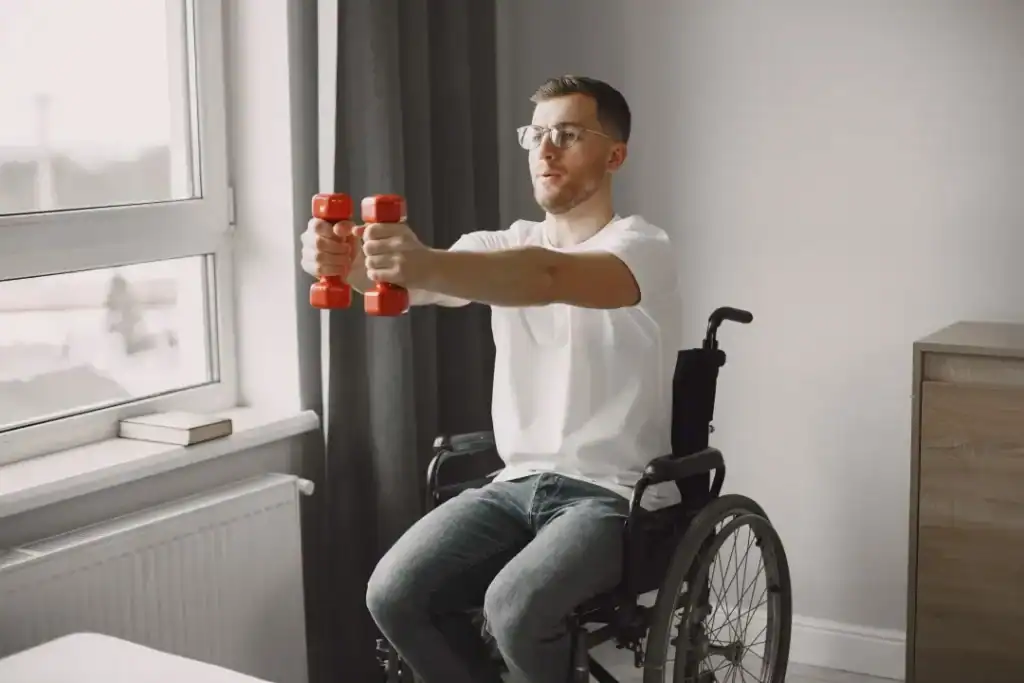 Empowering Weight Loss: A Comprehensive Guide for Individuals with Disabilities 1 Image of man doing exercise in his wheelchair to aid weight loss Dover