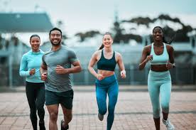 Sculpting Sleek Arms: The Essential Role of Cardio in Toning Without Bulking Up 3 image of people running to incorporate cardio Dover exercise into their life to help tone arms and body.