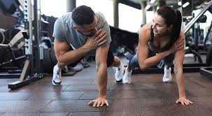 Sculpting Sleek Arms: The Essential Role of Cardio in Toning Without Bulking Up 1 Image of man and woman doing Cardio Dover to tone their arms.